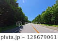 A clear day in Hokkaido on National Route 453 in July. Driving through the forest from Lake Shikotsu to Niseko. 128679061