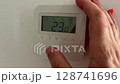 The air conditioning and heating control panel for the apartment , office is located on a white wall 128741696
