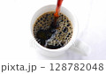 Freshly brewed, delicious coffee being slowly poured into a mug, slow motion stock footage 128782048