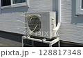 Air conditioner outdoor unit in operation 128817348