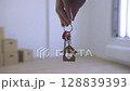The Hand Grasping the Keys in the Empty Space.  128839393