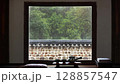 Rain and raindrops flowing on a traditional Korean Hanok window, rain falling on a wall, natural scenery with tea and tea sets, relaxing rain sound ASMR 128857547