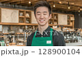 A young man working part-time at a fashionable cafe 128900104