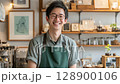 A young man working part-time at a fashionable cafe 128900106