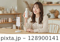 Influencer filming a video 128900141