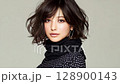 A young woman with a cool look 128900143