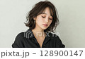 A young woman with a cool look 128900147