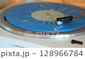 turntable with vinyl record. playing music 128966784