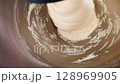 Mixing dough in a stand mixer. 128969905