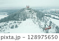Gorgeous landmark of Banska Stiavnica, church on top of the hill, winter, 4k 128975650