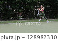 young female athlete running fast, slow motion video of running 128982330
