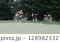 young female athlete running fast, slow motion video of running 128982332