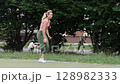 young female athlete running fast, slow motion video of running 128982333