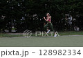 young female athlete running fast, slow motion video of running 128982334