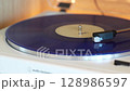 turntable with vinyl record. playing music 128986597