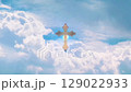 golden christian cross on blue sky light effect green screen background 129022933