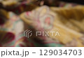 A Beautiful Colorful Textile Fabric CloseUp with Intricate and Detailed Patterns 129034703
