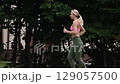 young female athlete running fast, slow motion video of running 129057500