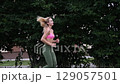 young female athlete running fast, slow motion video of running 129057501