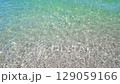 excitement of clear sea water on pebble coast, slow motion 129059166