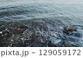 sea surf among stones, close-up, slow motion 129059172