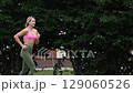 young female athlete running fast, slow motion video of running 129060526
