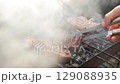 Grilling Juicy Beef Steaks Over Charcoal Fire 129088935