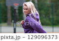 Running girl preparing for competition, race or marathon. Motivation, training for health and well-being on city streets, parks or roads. Sports, exercise, training and energy. 129096373