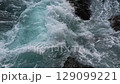 Green energy. Renewable energy sources. Perpetual motion machine. Pure turquoise waves break into white foam on the coastal cliffs. Power of nature. Water element 129099221