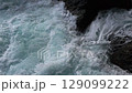 Green energy. Renewable energy sources. Perpetual motion machine. Pure turquoise waves break into white foam on the coastal cliffs. Power of nature. Water element 129099222