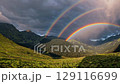 Double rainbow shines above sunlit valley symbolizing hope renewal joy connection nature happiness new beginnings unity and natural wonder 129116699