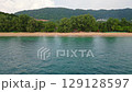 Aerial drone view of Ko Lanta island. Fly near coastline and famous long beach, turquoise water and white sand. Concept of vacation and relax in tropical paradise 129128597