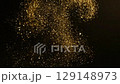 Gold particles, glitter, black background 129148973