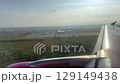 Scenic Airplane Landing with Airport in View on a Beautiful Sunny Day 129149438