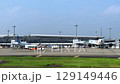 Vibrant Airport Scene with Parked Planes Under a Bright Sky 129149446