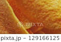 Golden Crispy Potato Chips Spinning in Bowl Overhead Macro Shot 129166125
