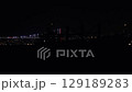 SIlhouette of big Ship On Night Sea. Illuminated coastline of Istanbul, Turkey. Sea transport at night. High quality FullHD footage 129189283