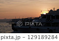 Istanbul sea harbor bay pier at sunset with boats going on calm wat. Beautiful highlights on the water. Turkey. FullHD footage 129189284