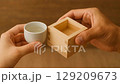 Toasting with sake cups and masu cups 129209673