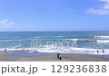A video of a summer vacation image with many tourists gathering at the sea and the blue sky beyond the horizon 129236838