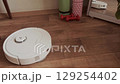 Robot removes dust from the floor with automatic system for efficient and hands free home cleaning every day 129254402