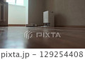Smart home assistant robot vacuums and mops the floor keeping the house clean with no effort from the homeowner 129254408