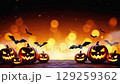 Spooky Halloween pumpkins and bats create an inviting autumn atmosphere at dusk 129259362