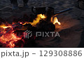 Coffee brewing on embers in desert at dusk 129308886