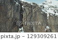 Panning Across the Sheer Rock Face of Eiger Mountain 1970s 129309261