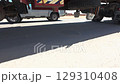 Underside view of heavy trucks at construction site 129310408