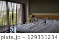 A child playing with a switch near a bed in a Japanese hotel 129331234