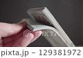 Hands counting one hundred dollar bills 129381972