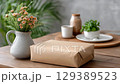 A large package is on the table.  129389523