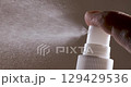 Liquid spraying fountain in a super slow motion of vaporized liquids particles. Shot on super slow motion camera 1600 fps. Spraying perfume. 129429536